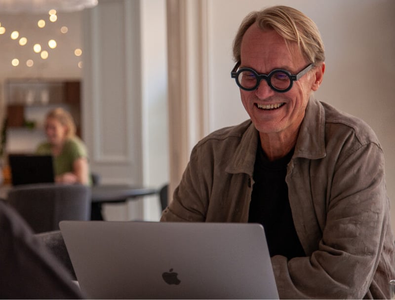 Anders sitting looking at laptop