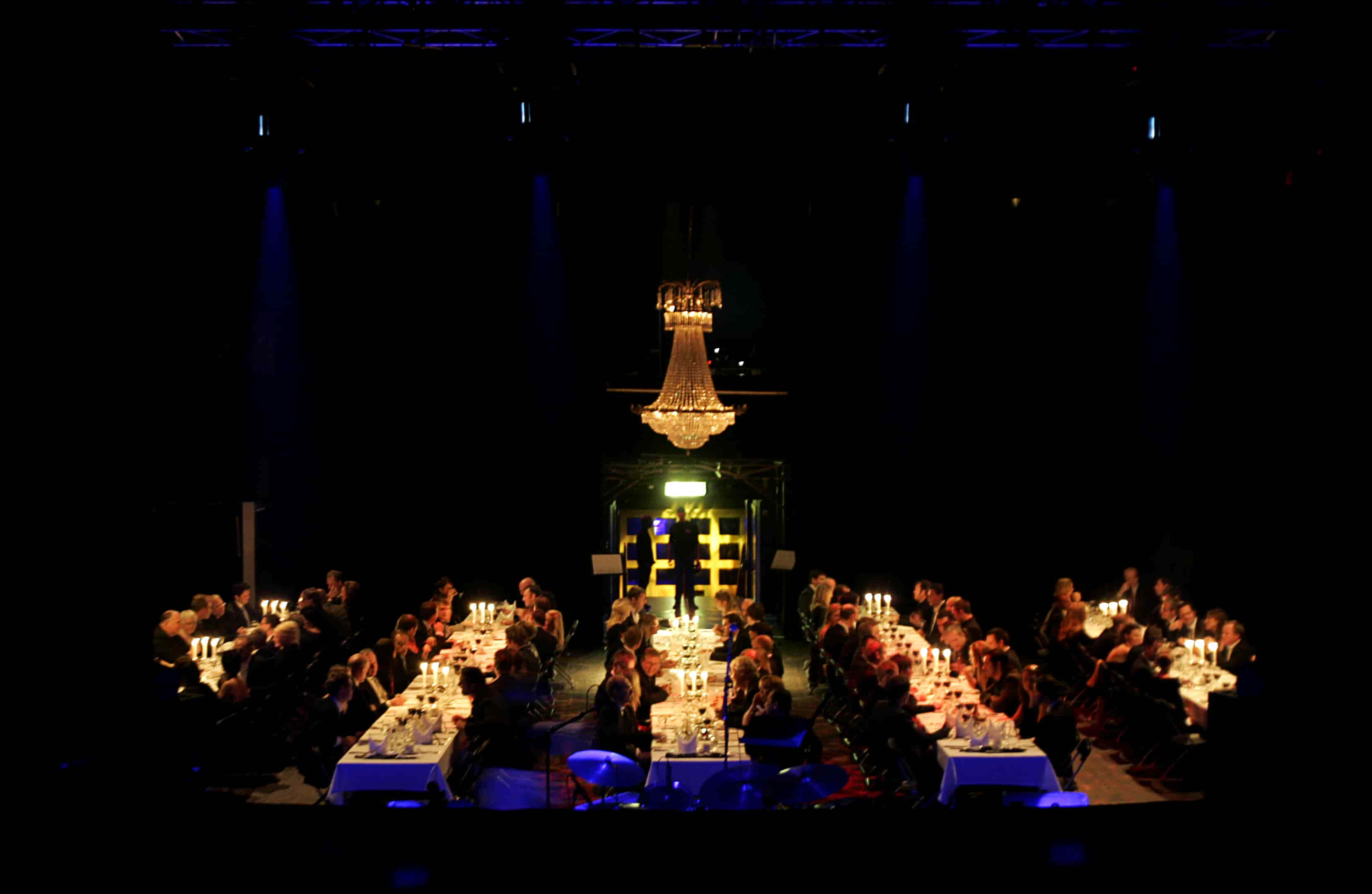 Zooma's 5th anniversary event at Storan Theater in Gothenburg, with guests seated on the stage, surrounded by elegant decor and lighting