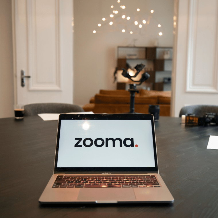 A laptop showing the updated Zooma logo