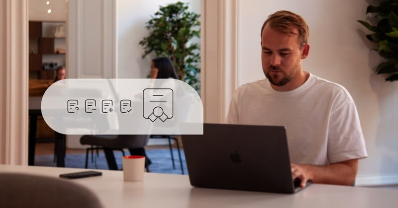 Man working on a laptop in a modern office with task/certification icons overlay.