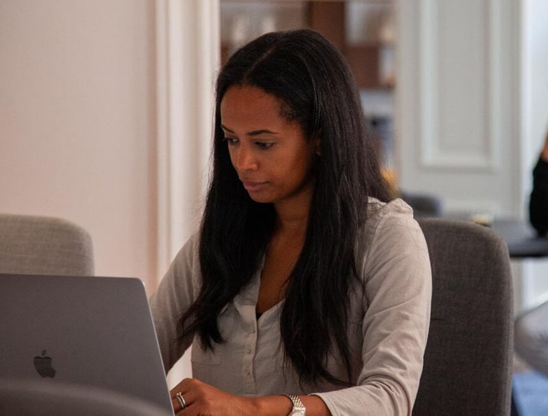 Niyat sitting in front of macbook