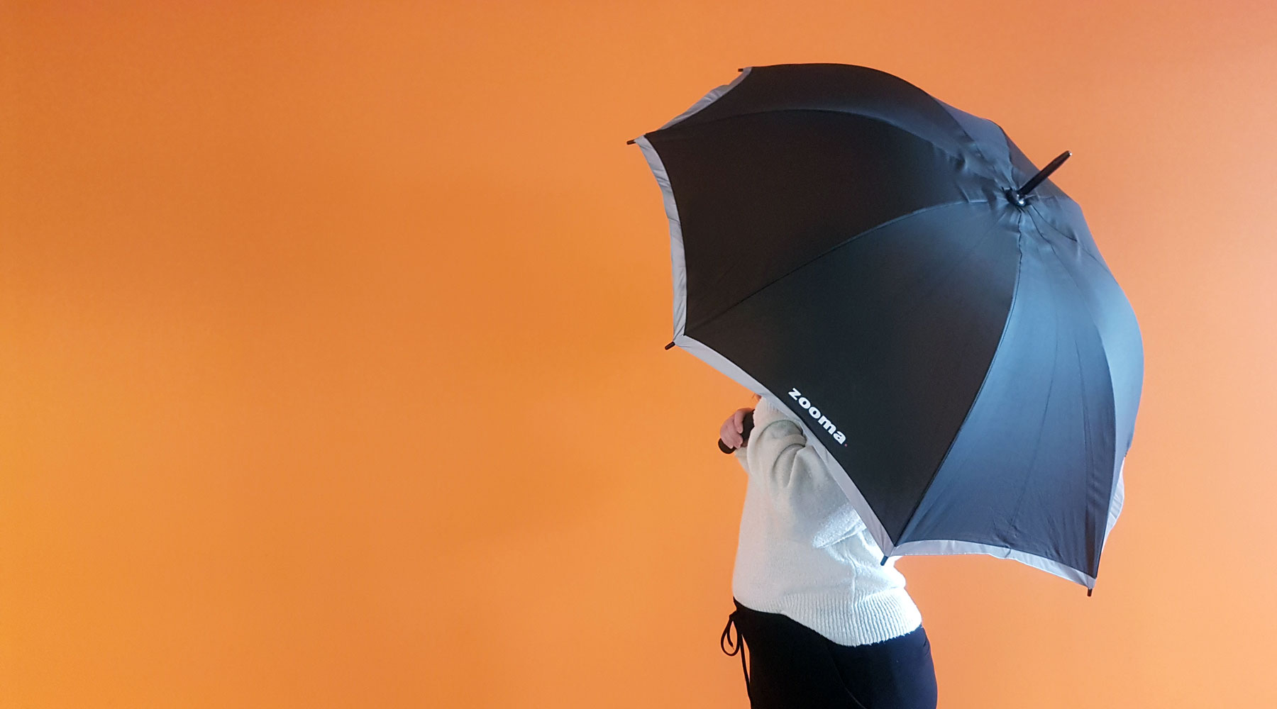 Person-holding-umbrella-in-the-office